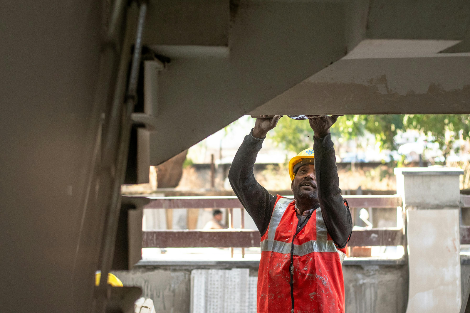 Construction Worker Inspecting Structure