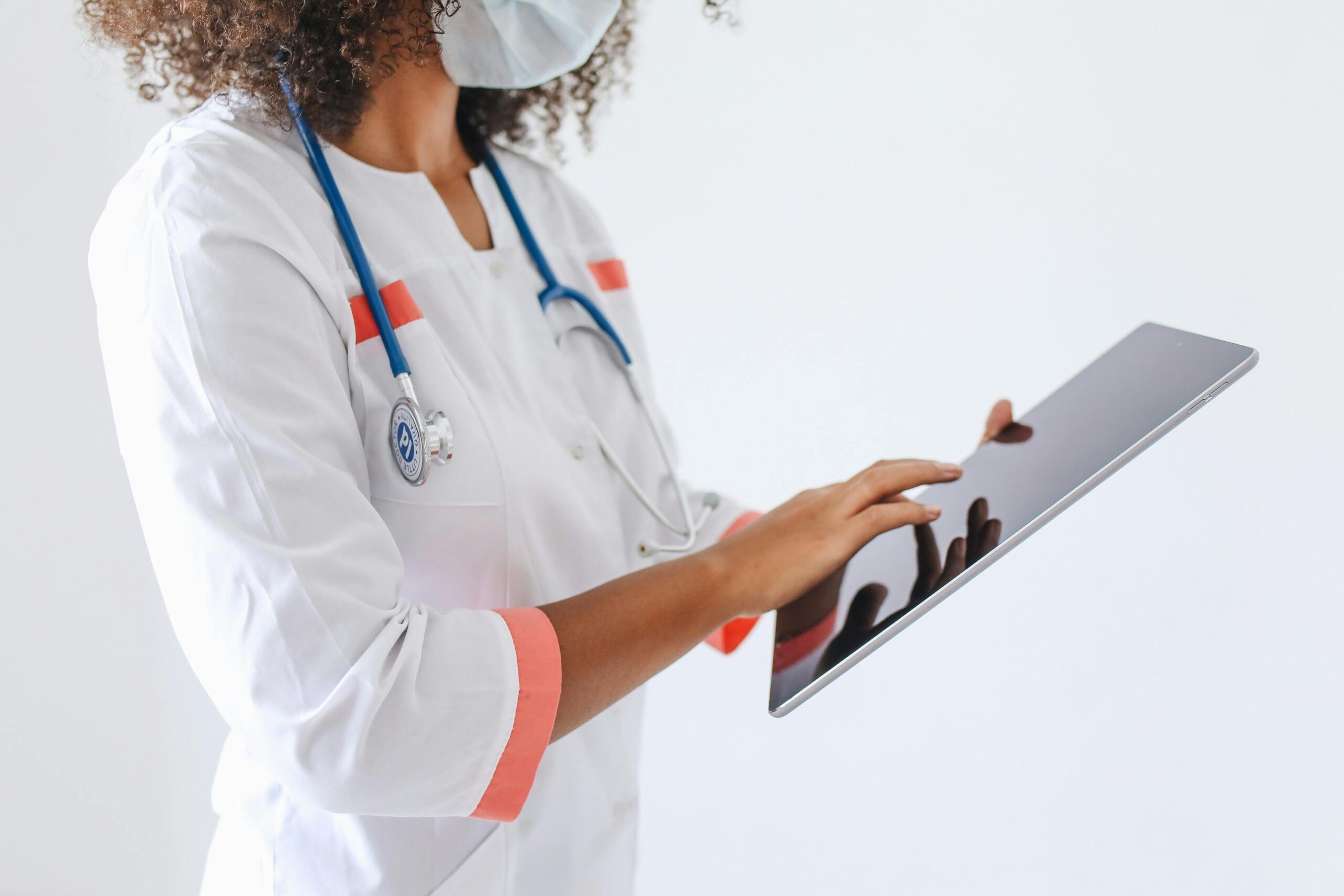 a doctor holding a tablet